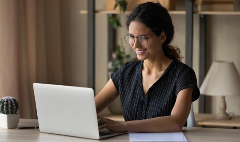 woman searching for Genex provider on computer