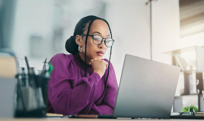 Woman look at options on a laptop. 